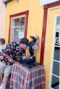 **6/4/2003**
Dan posing with the Mannequin Piss outside a Belgian chocolate shop, St. Maarten