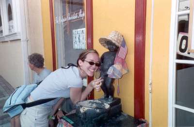 **6/4/2003**
Steph posing with the Mannequin Piss outside a Belgian chocolate shop, St. Maarten