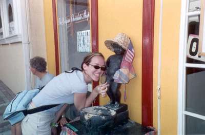 **6/4/2003**
Steph posing with the Mannequin Piss outside a Belgian chocolate shop, St. Maarten