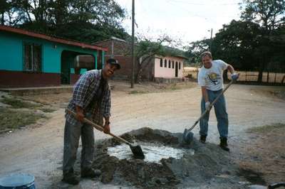 Sean and Wilmer mixing cement (4/10/02)