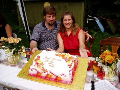 Mike and Heather with the bridal shower cake