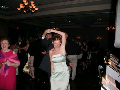 Julie dancing with her father at the reception.