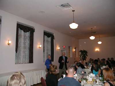 Larry and Tess giving a toast at the rehearsal dinner.