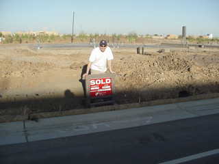 Sold!!! This was taken just a few days after we bought the house in May.  All that money for a slab of concrete! :) Kind of scary...