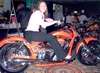Posing on custom bike at magazine convention we worked at, DC