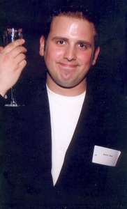 September 2002
Dan out networking..what is he holding?