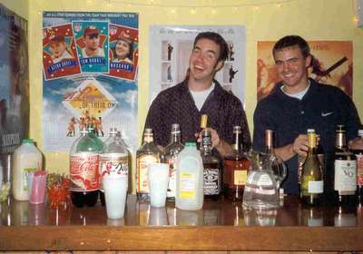 Boys will be boys. Craig and Marc (brides brothers) tending bar at our fathers 50th birthday bash.