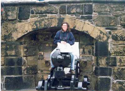 Melissa challenging a cannon in Scottland. (July 99)