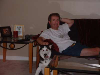 Can you believe it??? My father with my puppy at the house in NC. He looks real relaxed too....